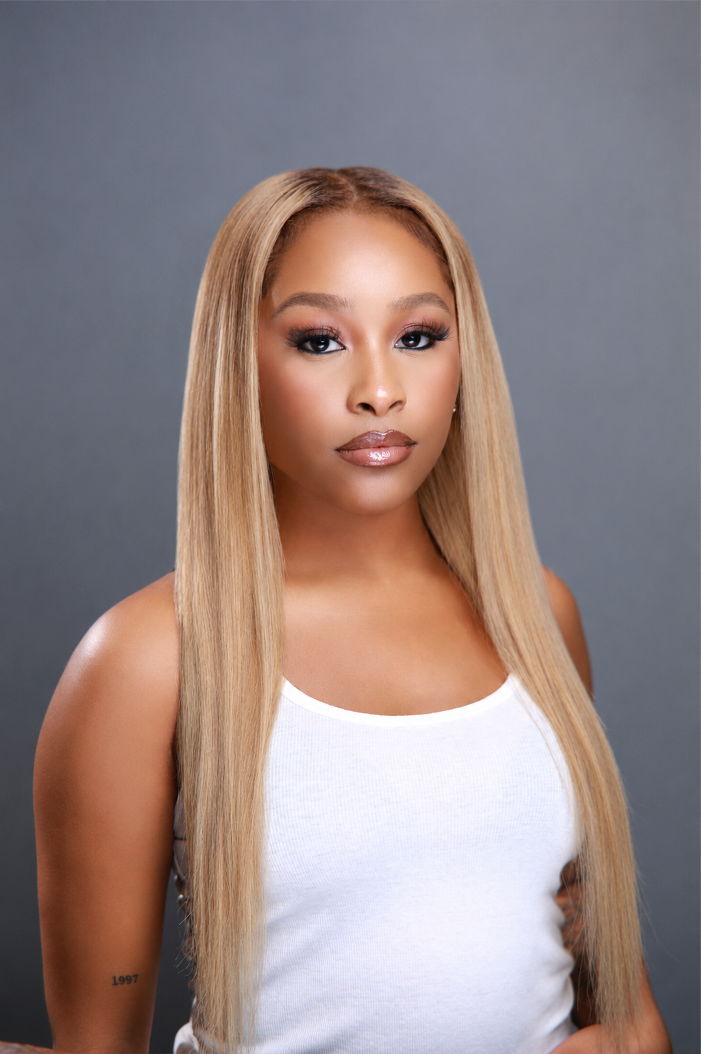 B. Xquisit U-Part wig made with custom colored blonde bundles