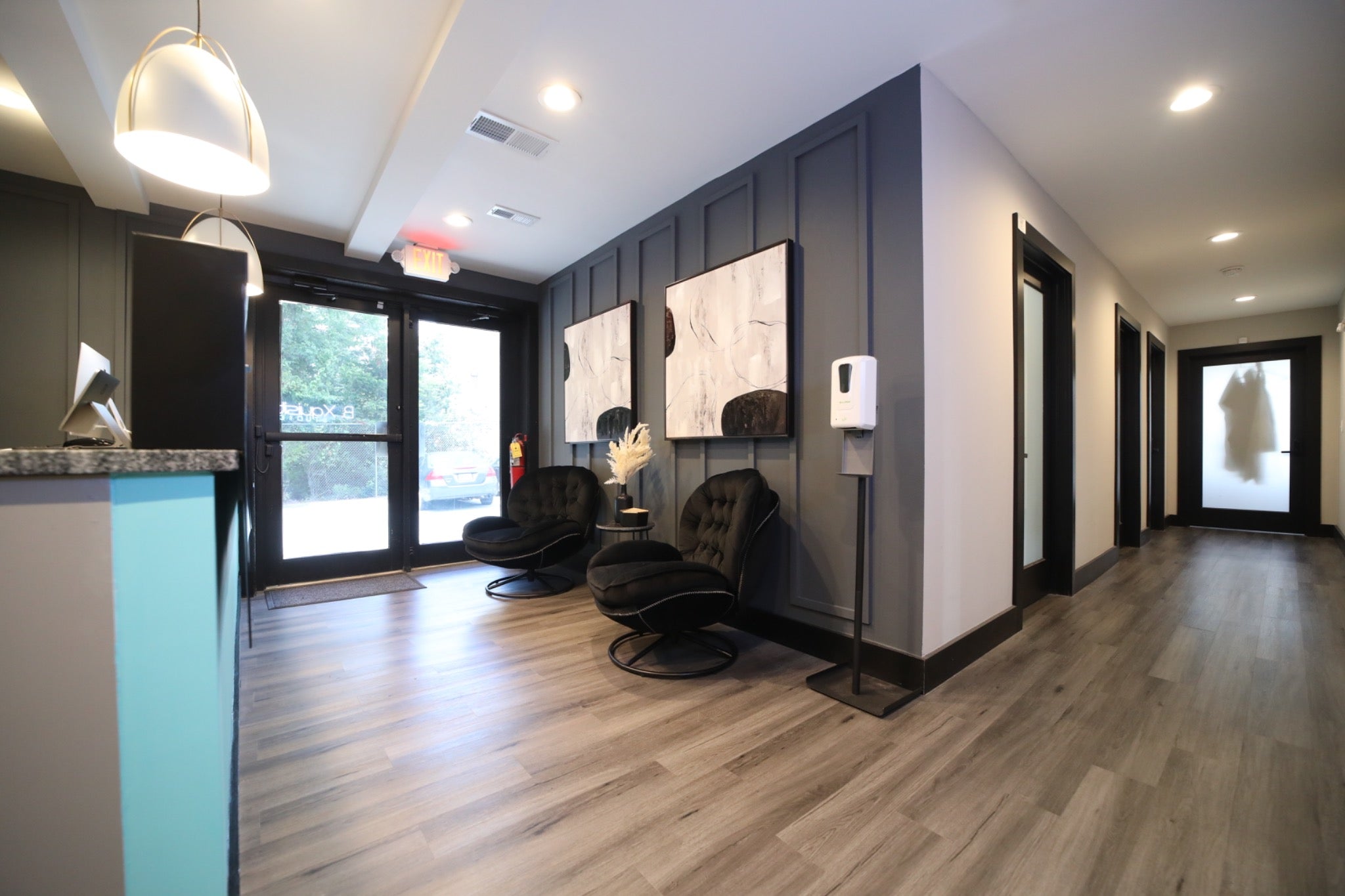 B. Xquisit Studios reception and client waiting area